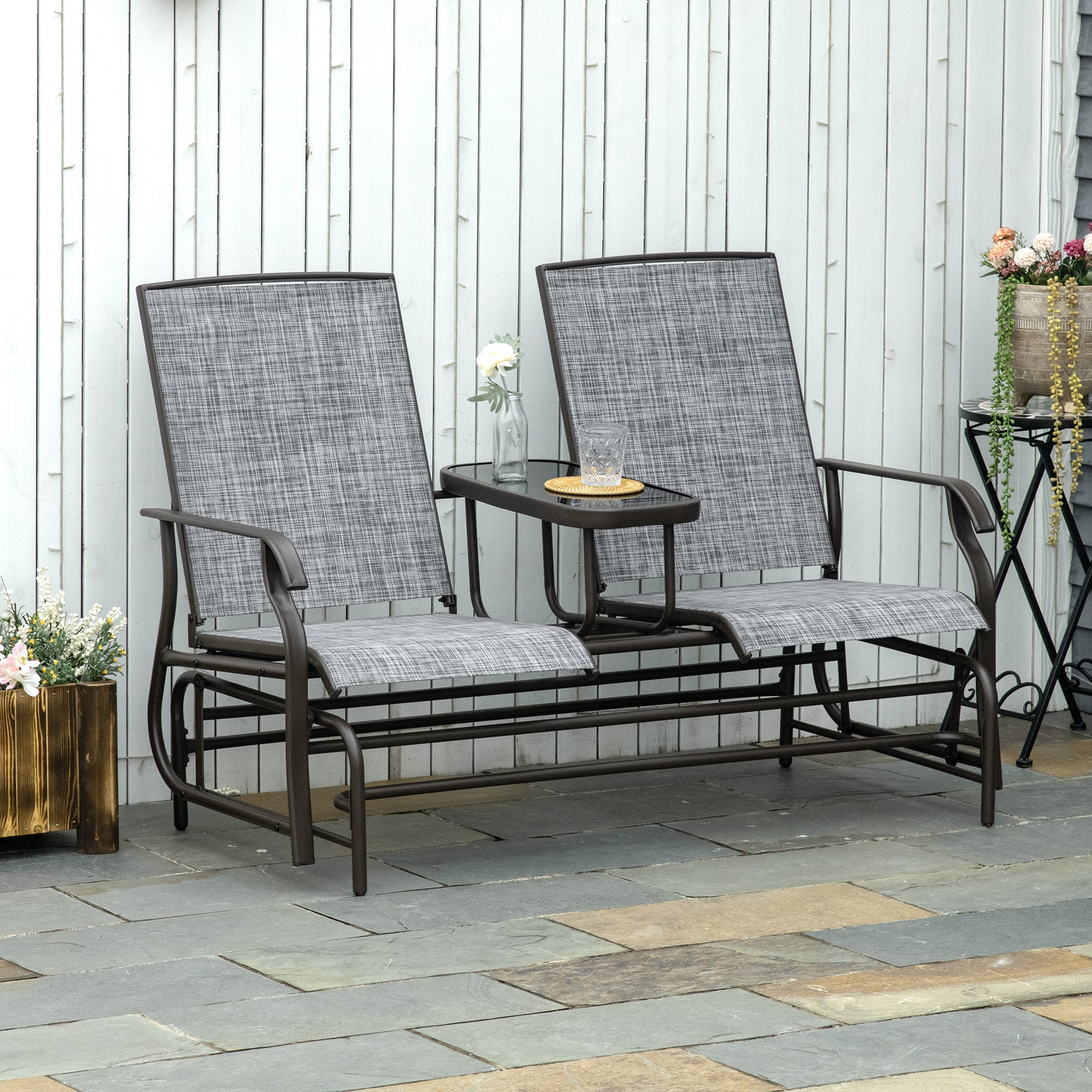 Outsunny 2 Seats Garden Glider Bench, Metal Frame Loveseat with Glass Top Centre Table, Porch Rocking Glider for 2 Person, for Deck, Patio, Brown/ Grey