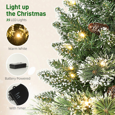 HOMCOM 60 cm Prelit Small Christmas Tree, Snow Flocked Tabletop Mini Xmas Tree with 35 LED Lights, Pine Cones and Linen Cover Base, Battery Operated, Green 
