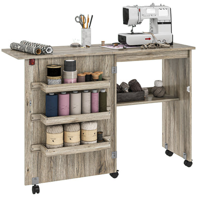 HOMCOM Folding Sewing Table, Drop Leaf Craft Table with Storage Bins, Open Shelf and Wheels, Rolling Sewing Machine Cabinet Computer Desk for Small Space, Grey 
