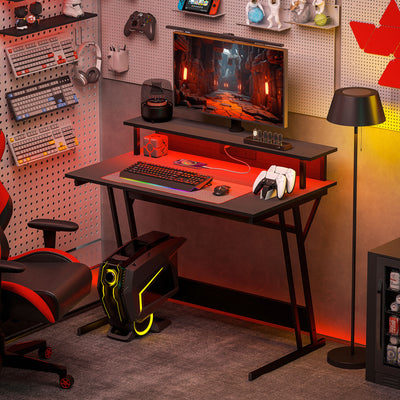 HOMCOM Gaming Desk with LED Lights and Power Outlets, 100 x 60cm Z Shaped Computer Desk with Monitor Stand and Steel Frame, PC Gaming Table for Home Office, Black 