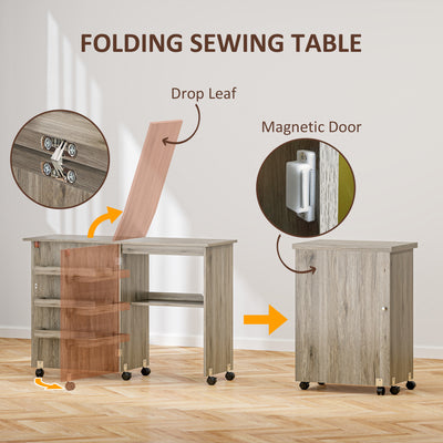 HOMCOM Folding Sewing Table, Drop Leaf Craft Table with Storage Bins, Open Shelf and Wheels, Rolling Sewing Machine Cabinet Computer Desk for Small Space, Grey 
