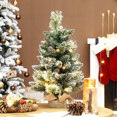 HOMCOM 60 cm Prelit Small Christmas Tree, Snow Flocked Tabletop Mini Xmas Tree with 35 LED Lights, Pine Cones and Linen Cover Base, Battery Operated, Green 