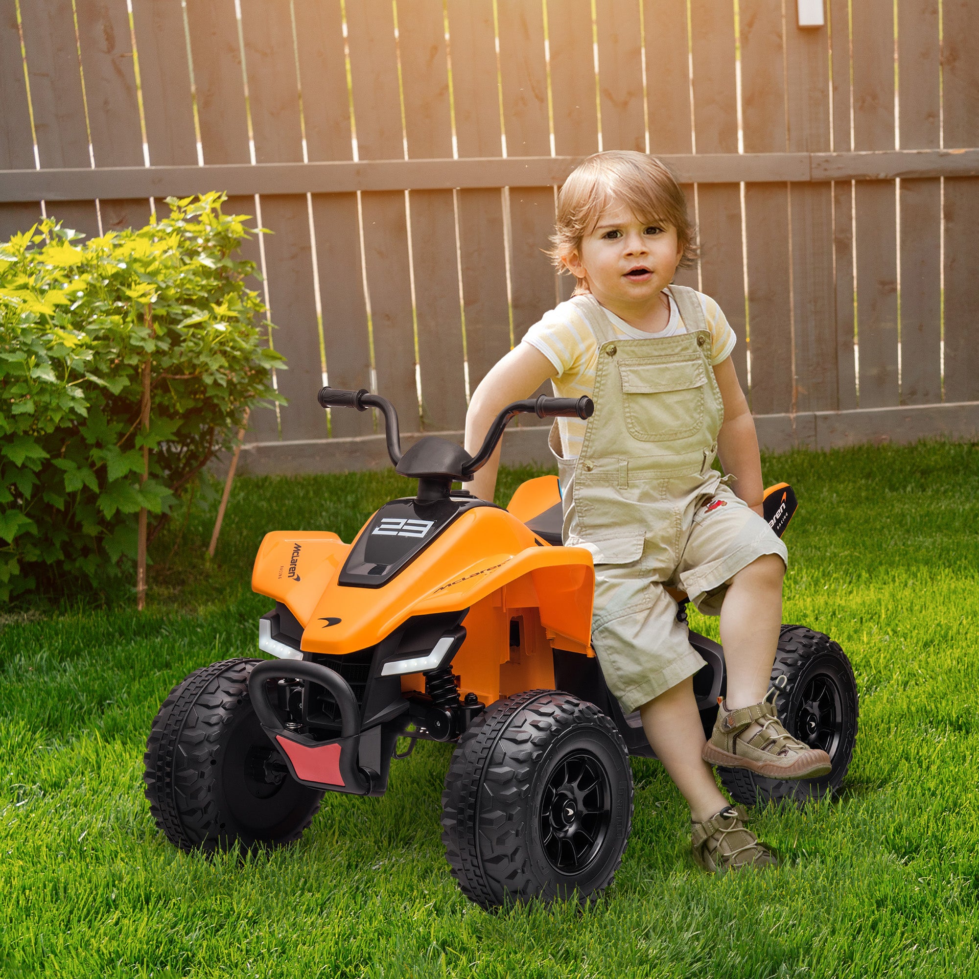 HOMCOM McLaren Licensed 12V Quad Bike, with Music, Headlights, MP3 Slot, Suspension Wheels, for Ages 3-8 Years - Orange 